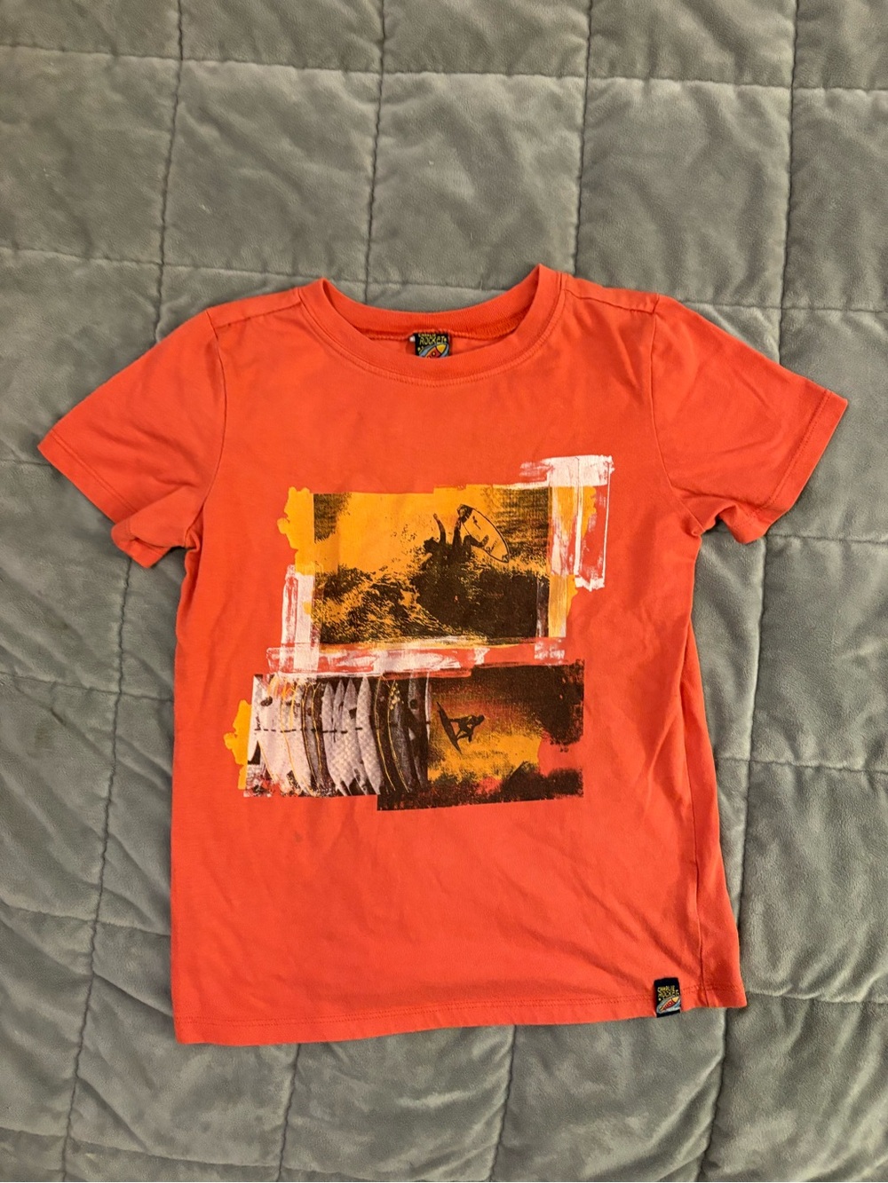 Charlie Rocket Orange Graphic Tee with Yellow Accents